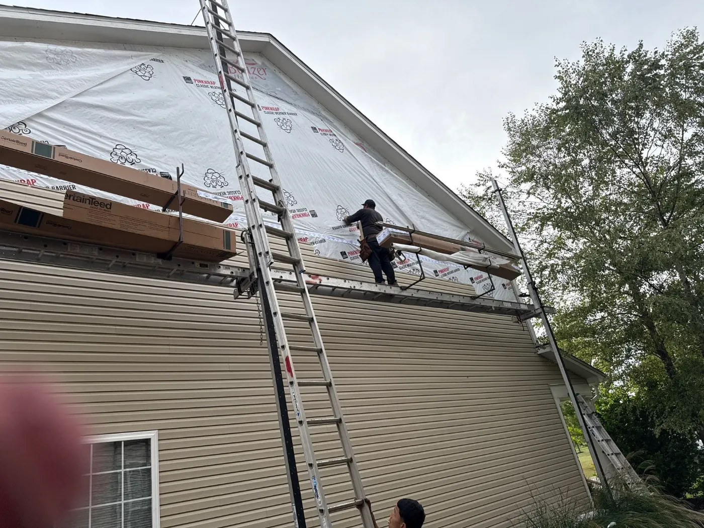Siding installation documented in Viking Meadows
